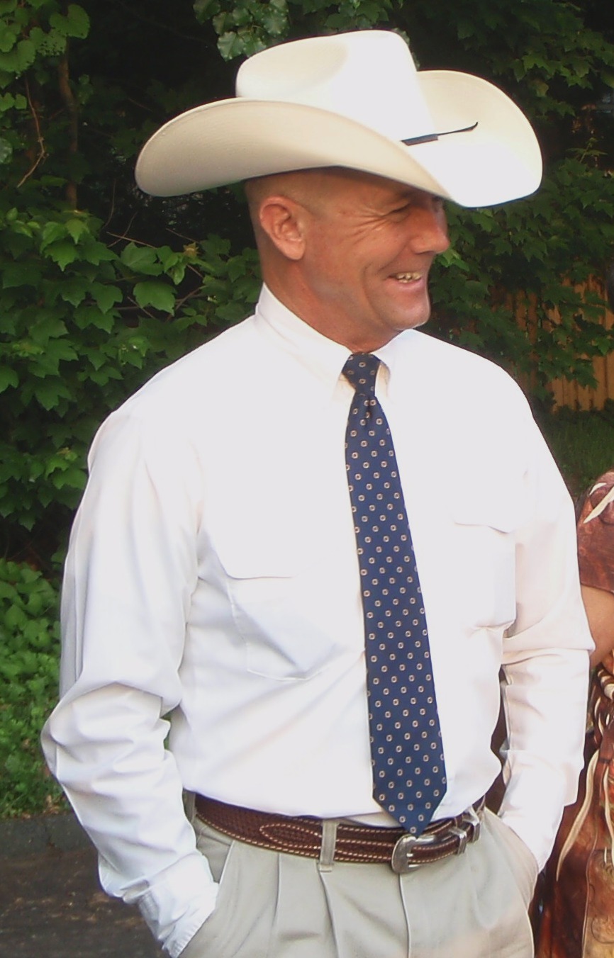 Barry English, a genuine cowboy, smiling at a celebration for his nephew's graduation from the United States Naval Academy in Annapolis, Maryland.