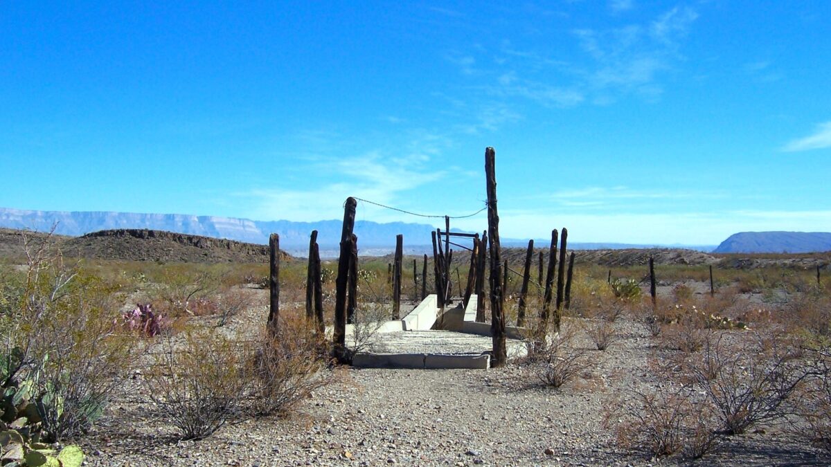 Remote Dipping Vat near Glenn Spring in Big Bend National Park, with distant mountains in the background.